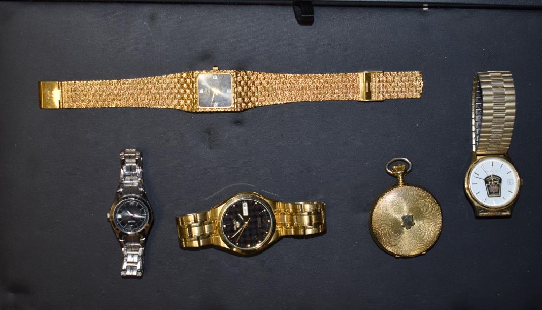 Wrist Watches and a Pocket Watch: Including a gold tone "Oleg Cassini" with an accented face, a Seiko 21 jewel with day, date and skeletal back, a Hamilton PA State Trooper watch, a lady's Pulsar with date and an "Arnex" pocket watch