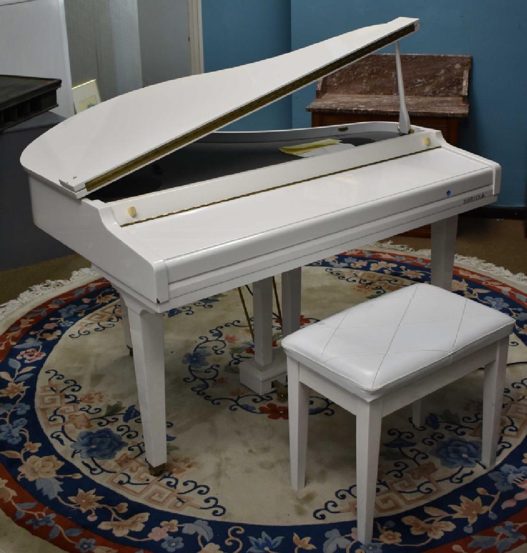 A "SamicK" Miniature Baby Grand Electric Piano: Item is model #SGP-151G. It is a white piano with a large selection of electronic functions. It is an estate item, it is fully functional, comes with bench and receipt of purchase is present.