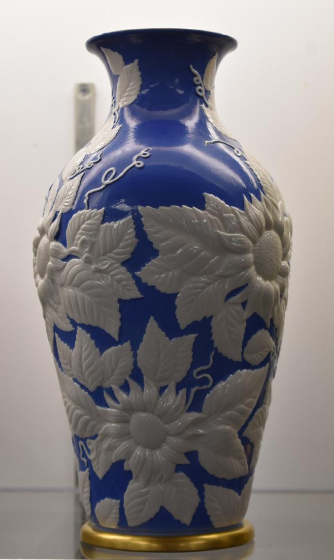 Antique Boehm Porcelain Vase: Finely decorated vase with large white sunflowers on a blue background; Edward Marshall Boehm #700/04 with Horse and feather mark.