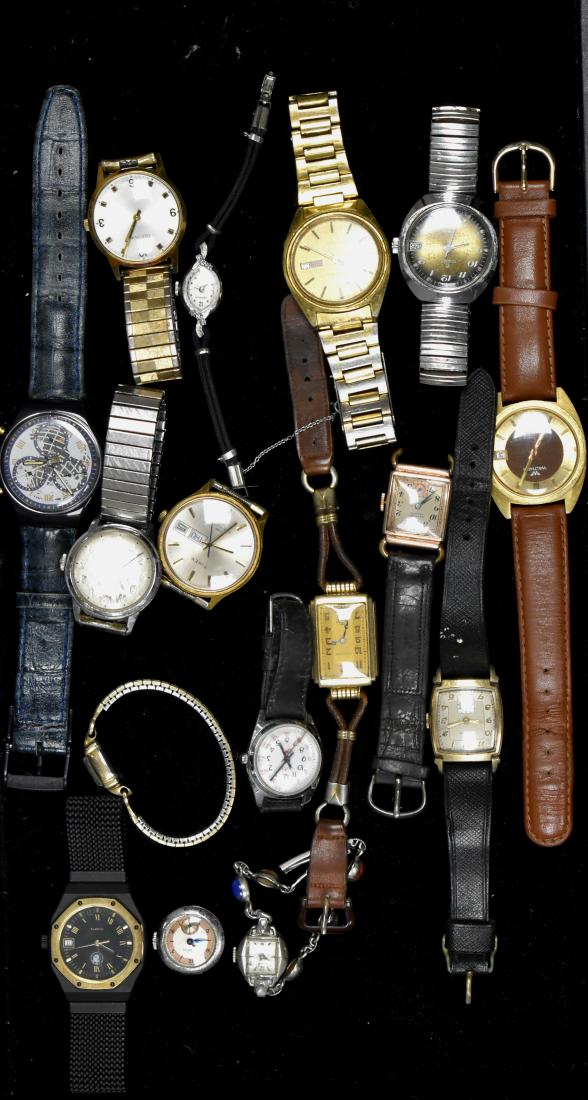 Collection of Watches: Including a men's "Waltham" with date, a men's gold tone Seiko, a "BMW" watch with a cloth band, a vintage lady's Elgin, a lady's "Winton" marked "Swiss", a lady's "Croton" and various others.