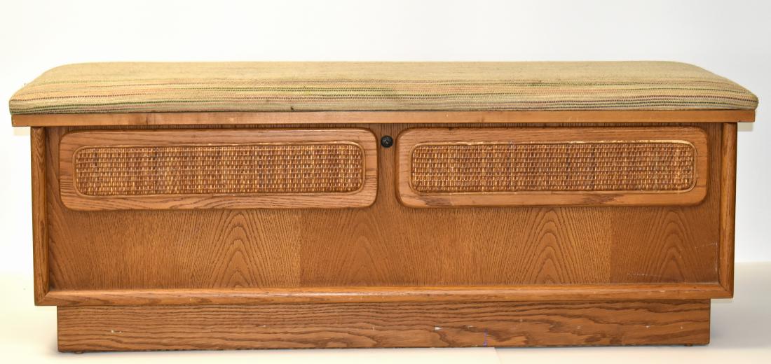Post Modern Lane Cedar Chest: Item measures approx. 18"h x 48"w x 17"d. It has an oak exterior with reeded panels, a cloth top (with stains) and a cedar interior marked "Lane".