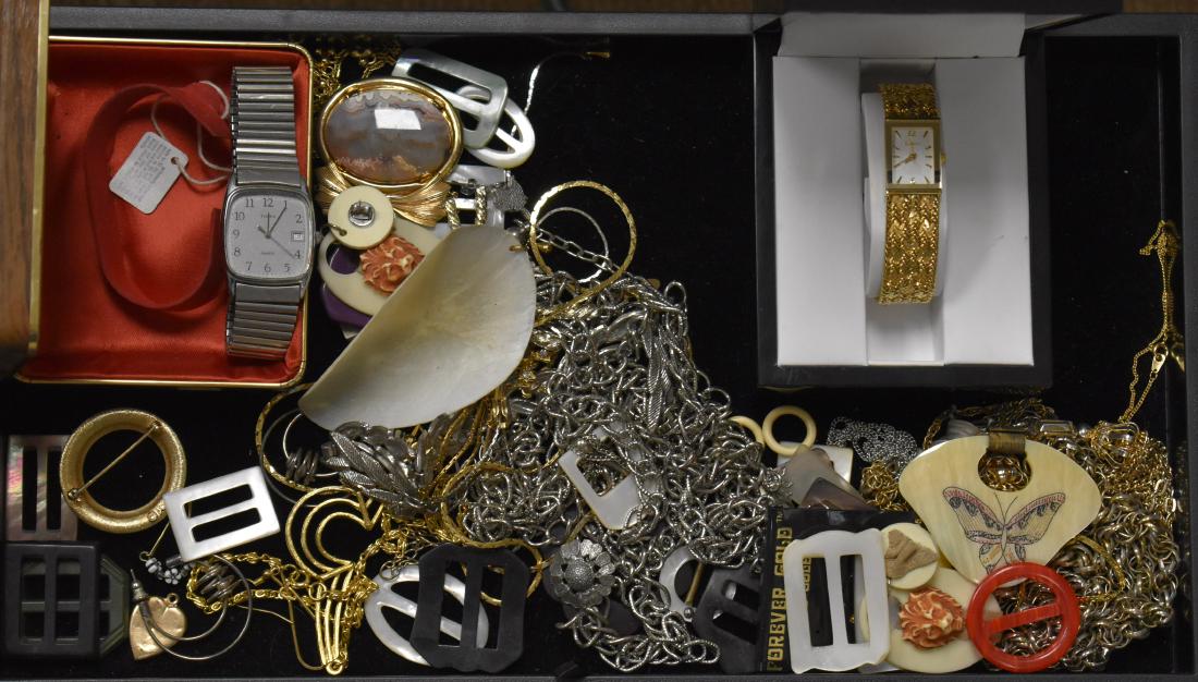 Mixed Costume Jewelry Grouping: Including a cameo locket on a chain, vintage plastic belt buckles, a lady's Elgin wrist watch in original box, a men's Timex in box and various other items.