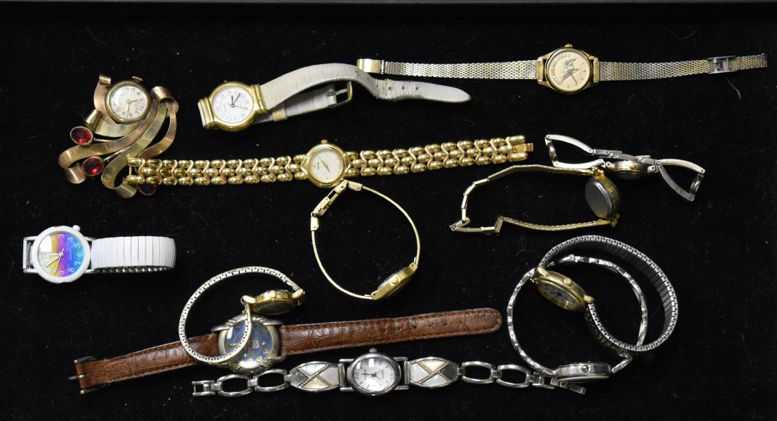 Grouping of Watches: Twelve watches including a "Miller and Rhoades" pendant watch, a lady's Pulsar, a lady's Geneva quartz, an Acutron marked "John Purdue Club" and others.