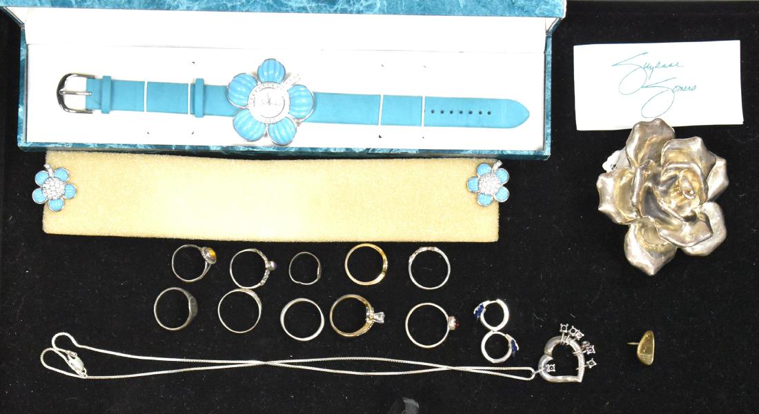 Sterling Jewelry Grouping: Including a large sterling rose brooch, nine small sterling rings, a sterling necklace with a heart pendant and a Suzanne Somers watch and earring set.