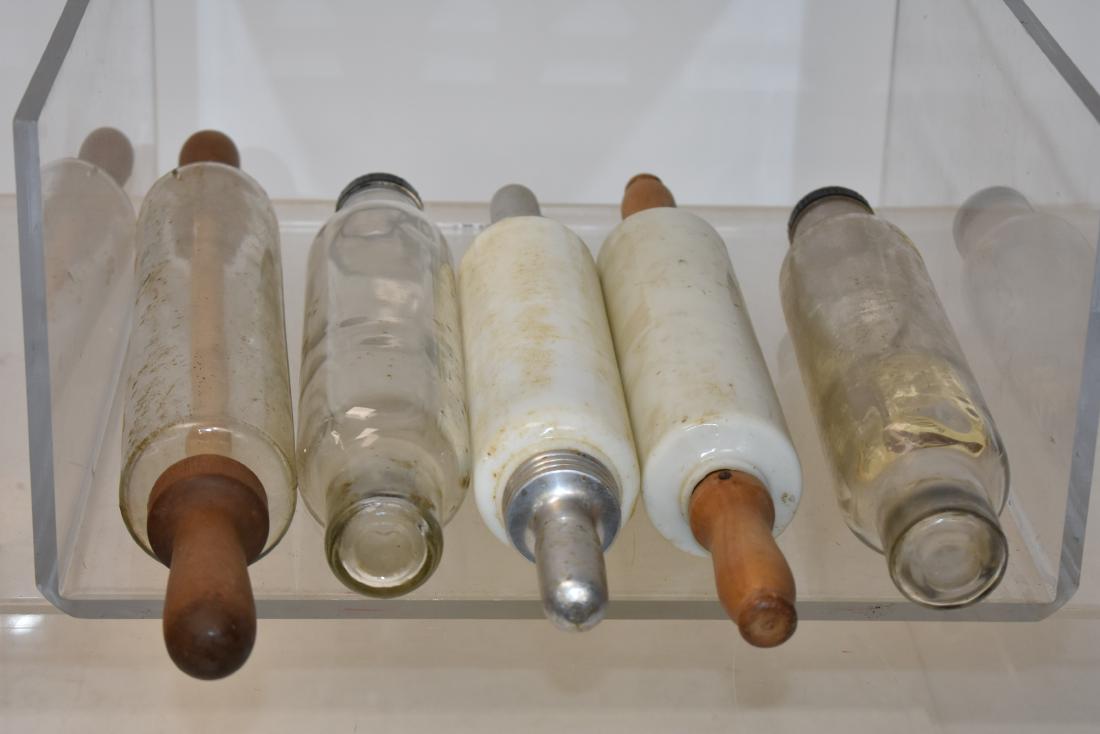 Five Glass Rolling Pins: Largest measures approx. 21" in length. Two are milk glass and one has original interior label with recipes.