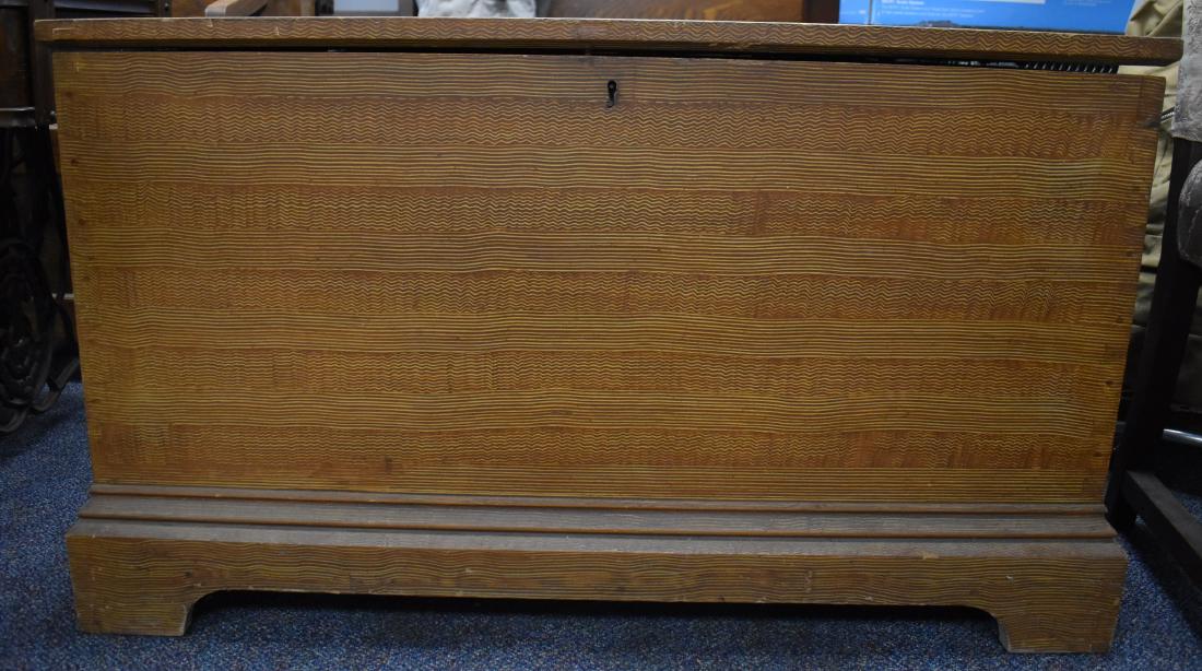 Comb Decorated Pennsylvania Blanket Chest: Item measures approx. 22"h x 37"w x 22"d. It is pine construction with a walnut till. It has a yellow and umber comb decorated surface with hand dove tailed case and feet.