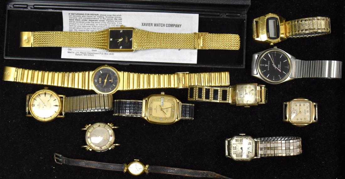 Quality Watch Grouping: Men's watches include "Xavier" with a gold tone band, a "Bucherer " 25 jewel marked "Swiss", a "Bill Blass", a Benrus marked "Swiss" and others. Lady's watches include "La Marque" marked "Swiss" and a