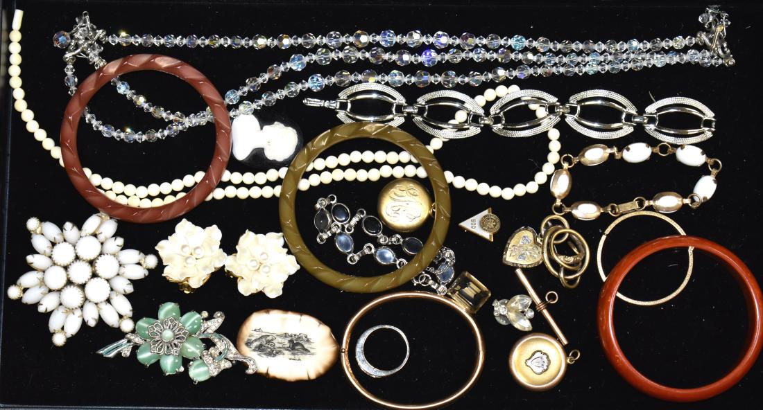 Mixed Costume Jewelry: Including three bangle bracelets, a crystal necklace, floral clip earrings marked "Parklane", two lockets and other quality jewelry.