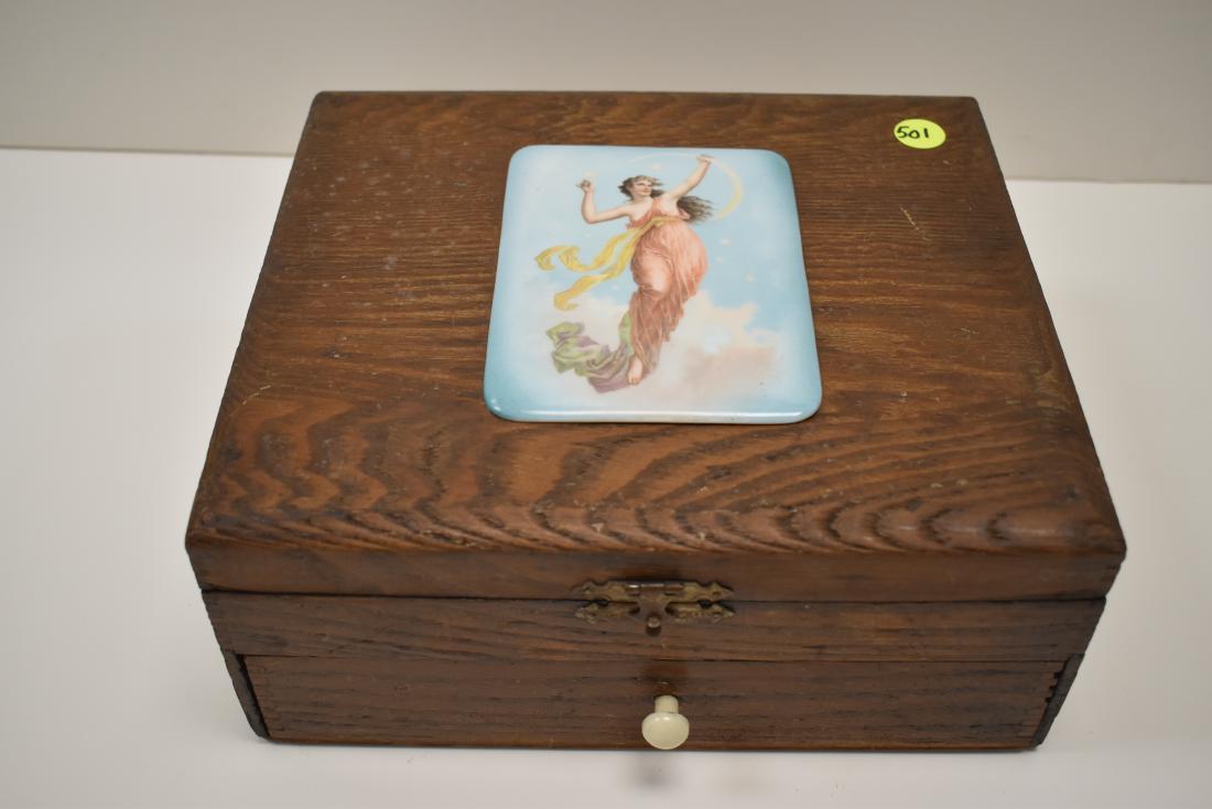 Art Nouveau Cigar Box: Art Nouveau cigar box with pull out drawer, handles on sides and porcelain plaque on top. Approx. 9" x 10" x 4"