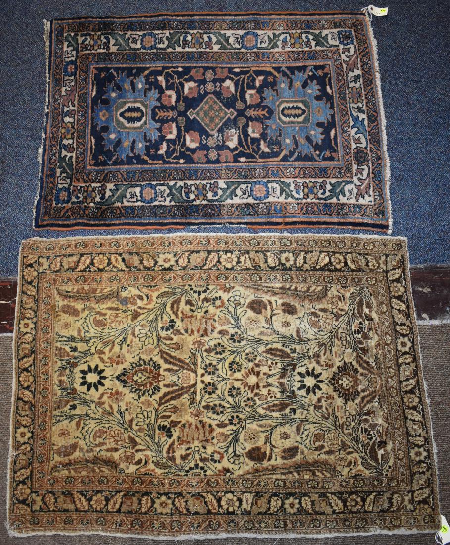Two Hand Made Oriental Throw Rugs: Both measure approx. 42"long x 31"w. The first is brown with a floral design and the second is multi color and shows some thread wear.