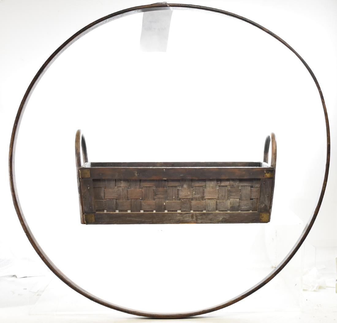 Basket and a Hoop: Hoop measures approx. 31"dia. It is from a 19th century hoop and stick game. Lot also includes a 20th century handled basket.