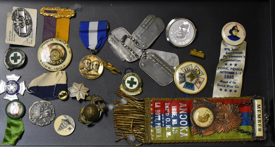 Lodge Items and Medals: Including an early "O.R.M." ribbon with an Indian chief medallion, a 1904 "Cashmere Temple" pin from York, Pa, a 1946 Eagle Fire Co. pin from York, Pa and various medals and dog tags.
