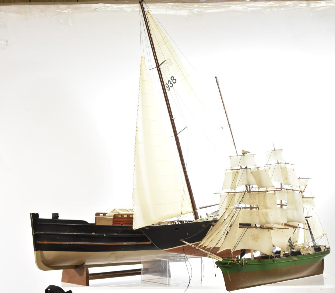 Three Model Ships: Largest is a plastic sailboat measuring approx. 21" in length. Lot also includes a plastic tall ship and a wooden fishing boat missing masts,