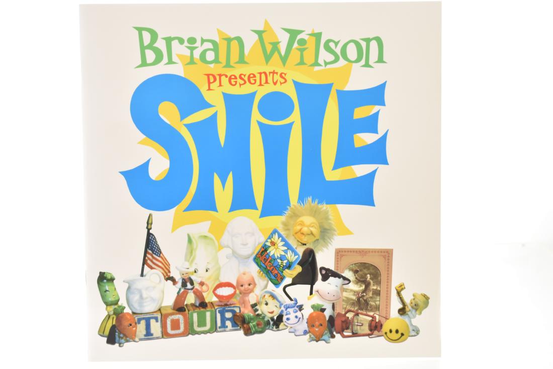 Autographed Book "Smile" by Brian Wilson": Soft back book "Smile" by Brian Wilson. The sleeve is autographed by Probyn Gregory and there are two other illegible signatures.
