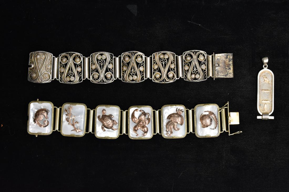 "Handarbeit" Silver Bracelet and Others: Lot includes a 800 silver filigree marked "Handarbeit", a bracelet with mother of pearl sections and sterling silver sea creatures and a sterling Egyptian cartouche pendant.