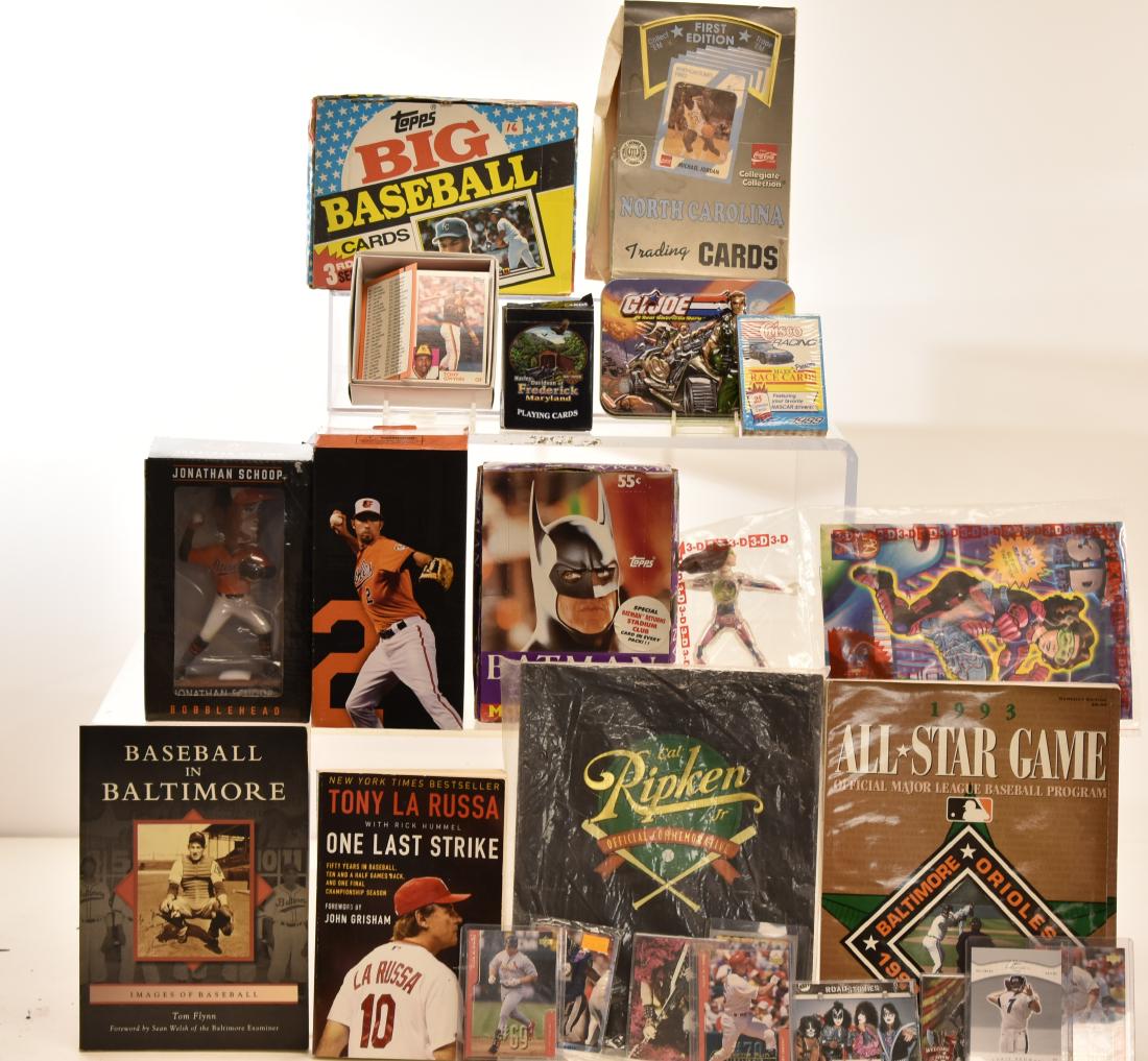 Sports Cards and Memorabilia: Includes Cal Ripken books, an Orioles bobble head, other baseball books, baseball and basketball cards, Batman cards, GI Joe and Kiss cards.