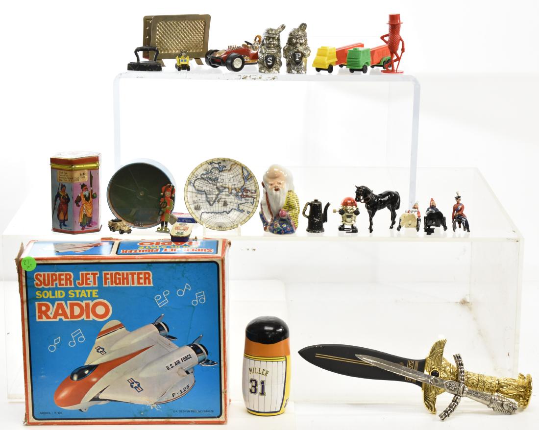 Super Jet Fighter Radio and Toys: Lot includes a Super Jet Fighter solid state radio in original box - item is pre sku tag, three Britains type figures, two truck Pez, two toy daggers and other items.