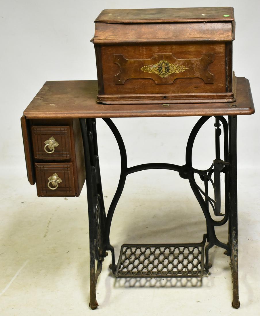 Singer Treadle Sewing Machine: Measures approx. 40"h x 31"w x 16"d. and has a worn surface.