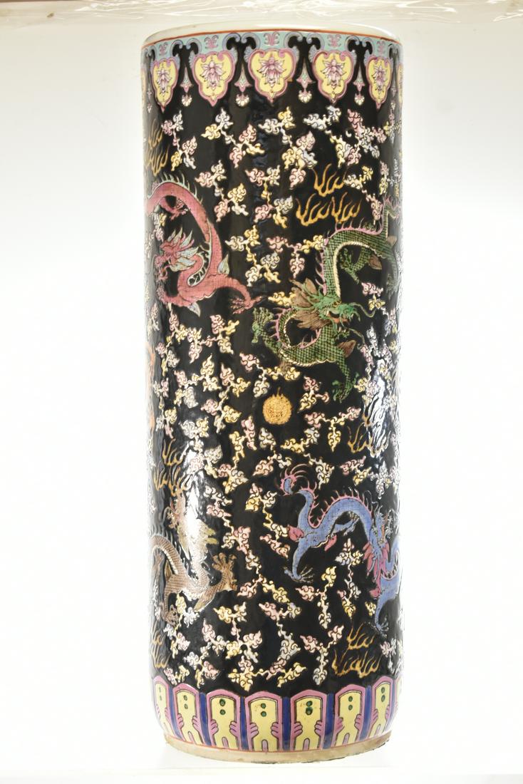 Chinese Umbrella Stand with a Dragon Motif: Measures approx. 24"h. It has a textured surface and is covered in various Chinese dragons. Item has a chop mark on bottom and is a quality contemporary item.