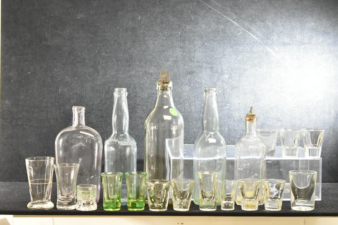 Collection of Vintage Bottles & Shot Glasses: Lot includes a "Gladiator" barber bottle, a "York Brewing Co." bottle, a "Schmidts Hanover" bottle - five total bottles. Lot also includes fifteen shot glasses - two are green, one is a jigger and one