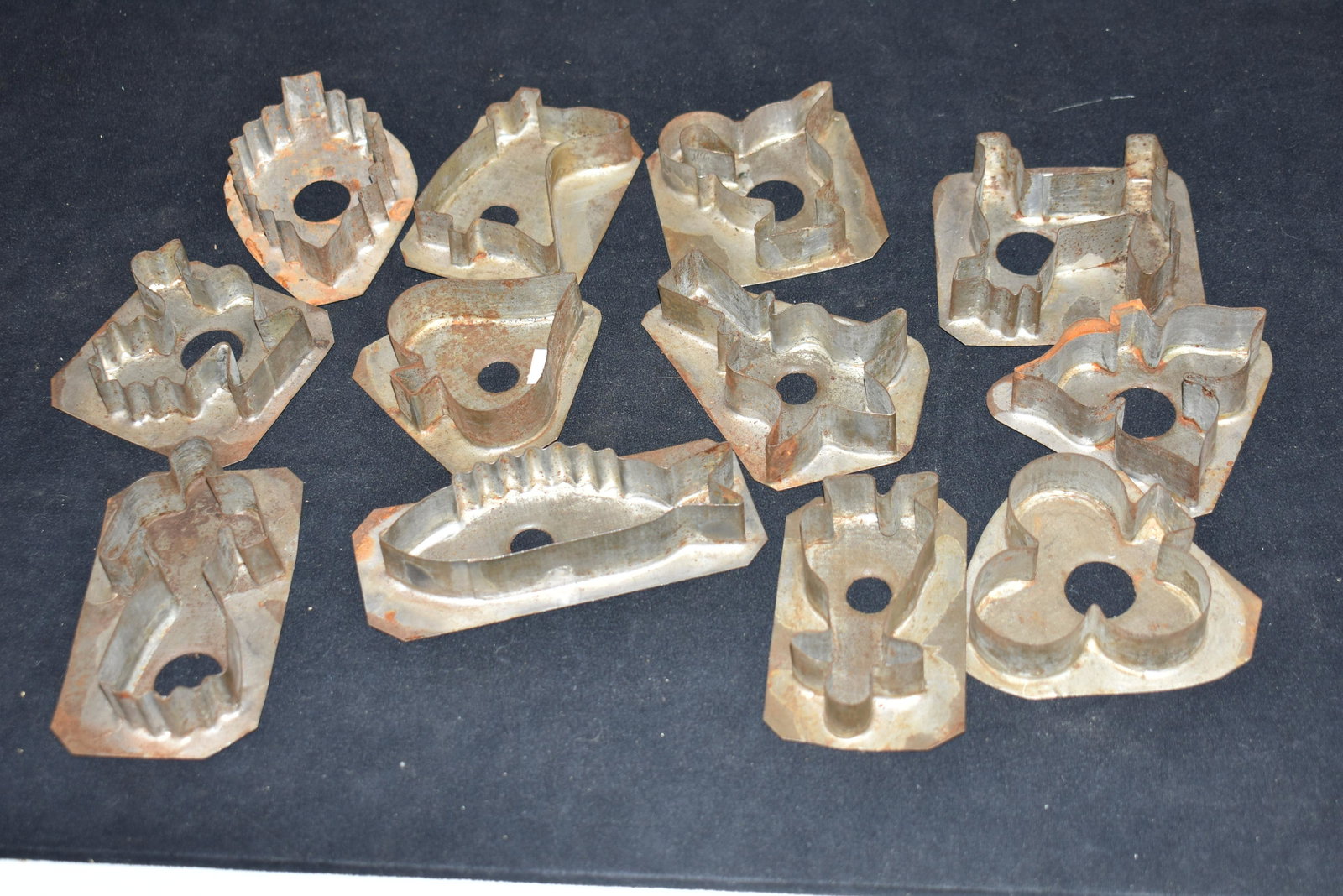 19th Century Cookie Cutter Collection: Various shapes including Rooster, dog, leaf, people, tulip, boot, fish, teapot, angel, and others. 12 total