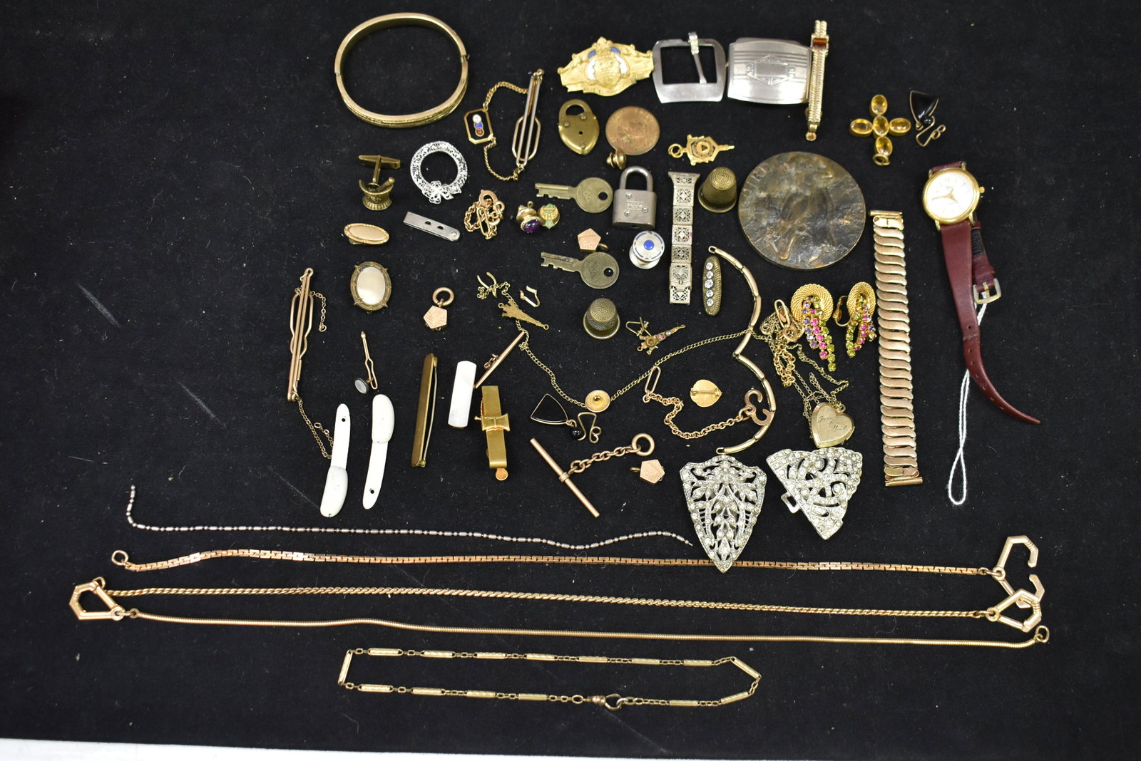 Collection of Men's and Ladies Costume Jewelry: Including a Bengal Fur clips, pins, and thimble, Thai clips, a French Token and more.