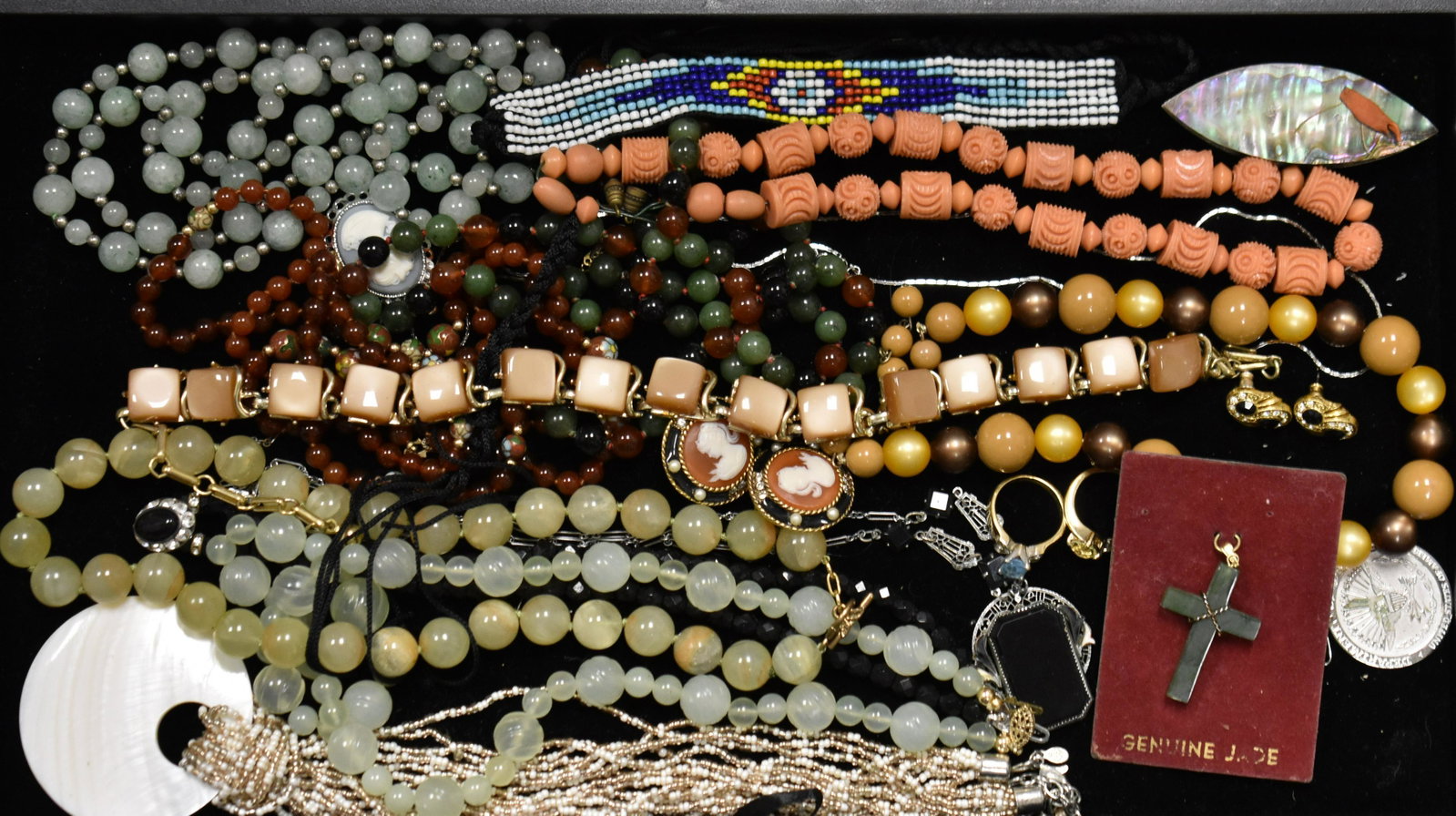 Costume Jewelry Grouping: Including beaded necklaces, Cameo earrings, a Jade cross and other quality items.