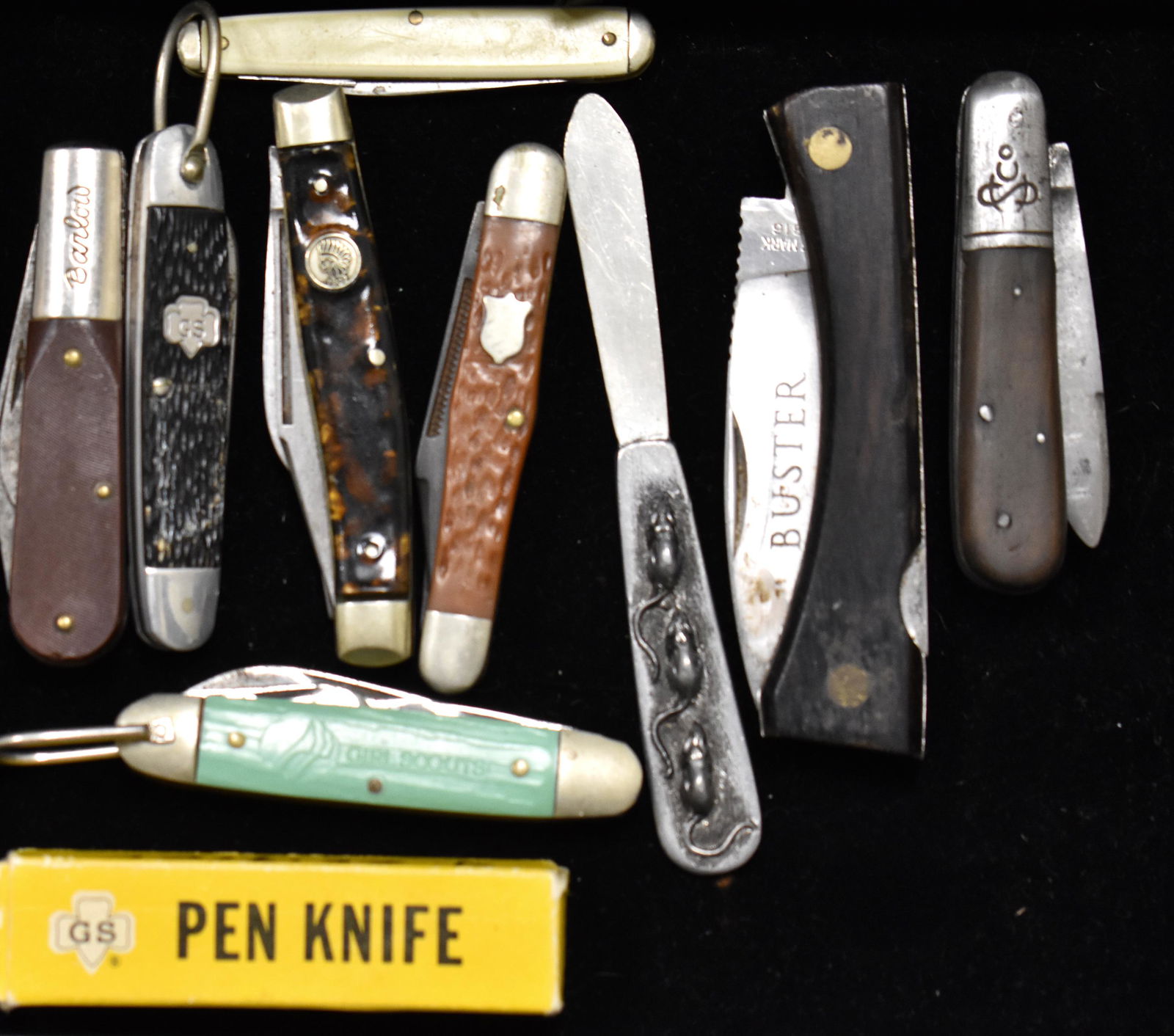 Pocket Knife Collection: Including two Girl Scout knives a Barlow a Buck Creek "Indian head", a Buster with wooden case and others