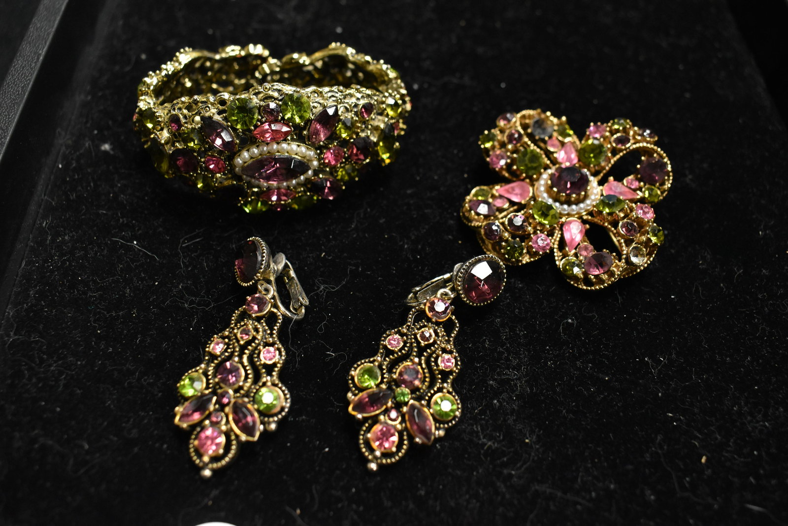 Hollycraft and Florenza Rhinestone Jewelry: including a pink, purple and green rhinestone Florenza brooch and Hollycraft drop earrings and unsigned bangle.