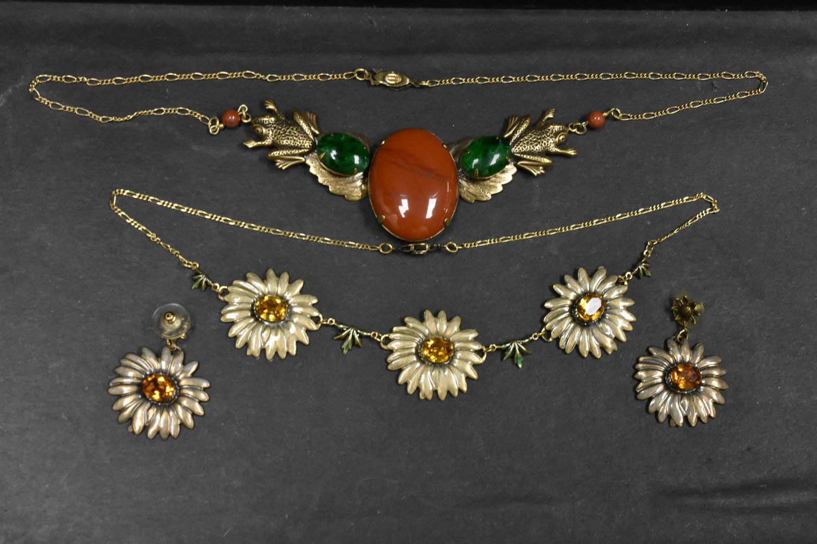 "Sadie Green" Necklaces and Earrings: includes two necklaces, one is a set with matching pierced earrings and appears to be sunflowers or daisies with topaz/orange color rhinestone and the other has green/malachite and orange stone with f