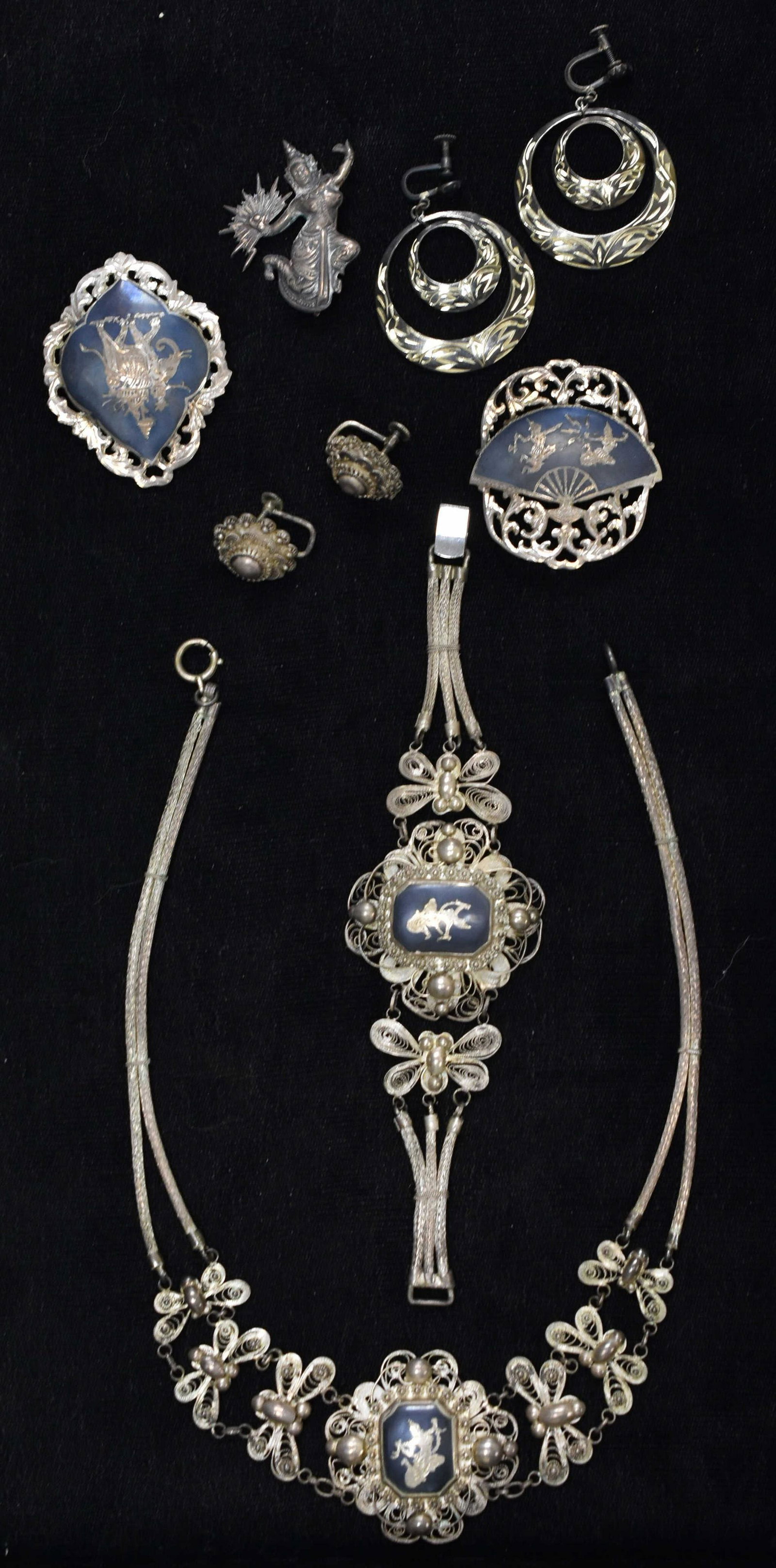 Siam Sterling Jewelry Collection: including a large necklaces, three figural pins, a bracelet and two pair of earrings. Marked Siam Sterling.