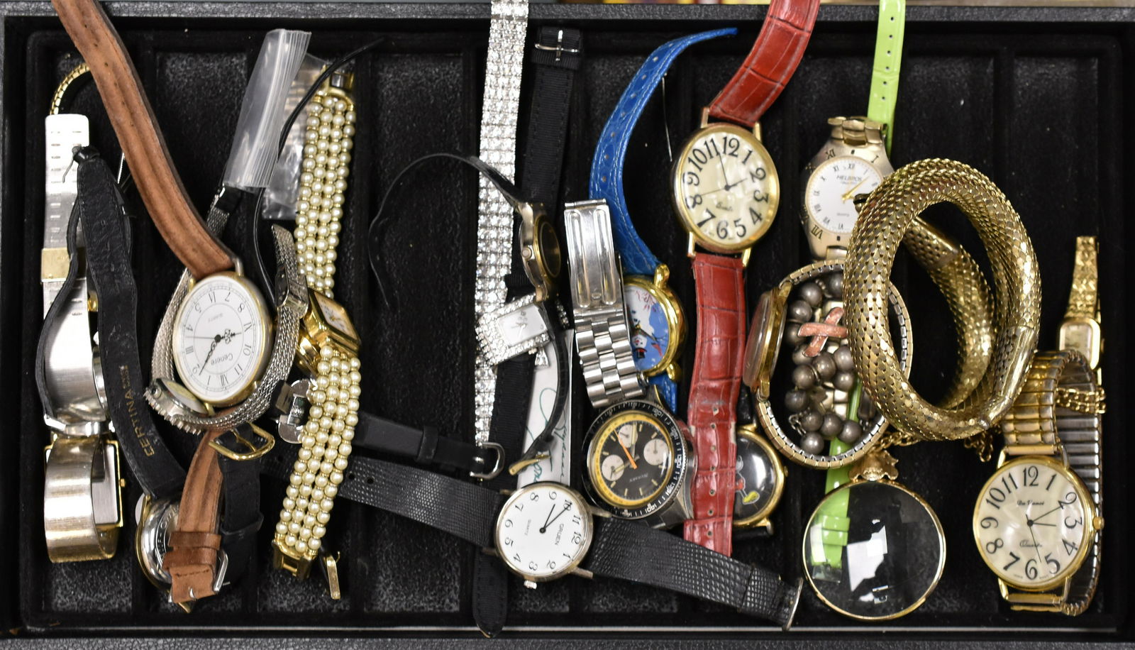 Collection of Ladies and Men's Wrist Watches: Including Men's watches by Omega, Cerene, Sussex marked Swiss made. Ladies watches include Bill Blass, Geneva, Sunrise and others.