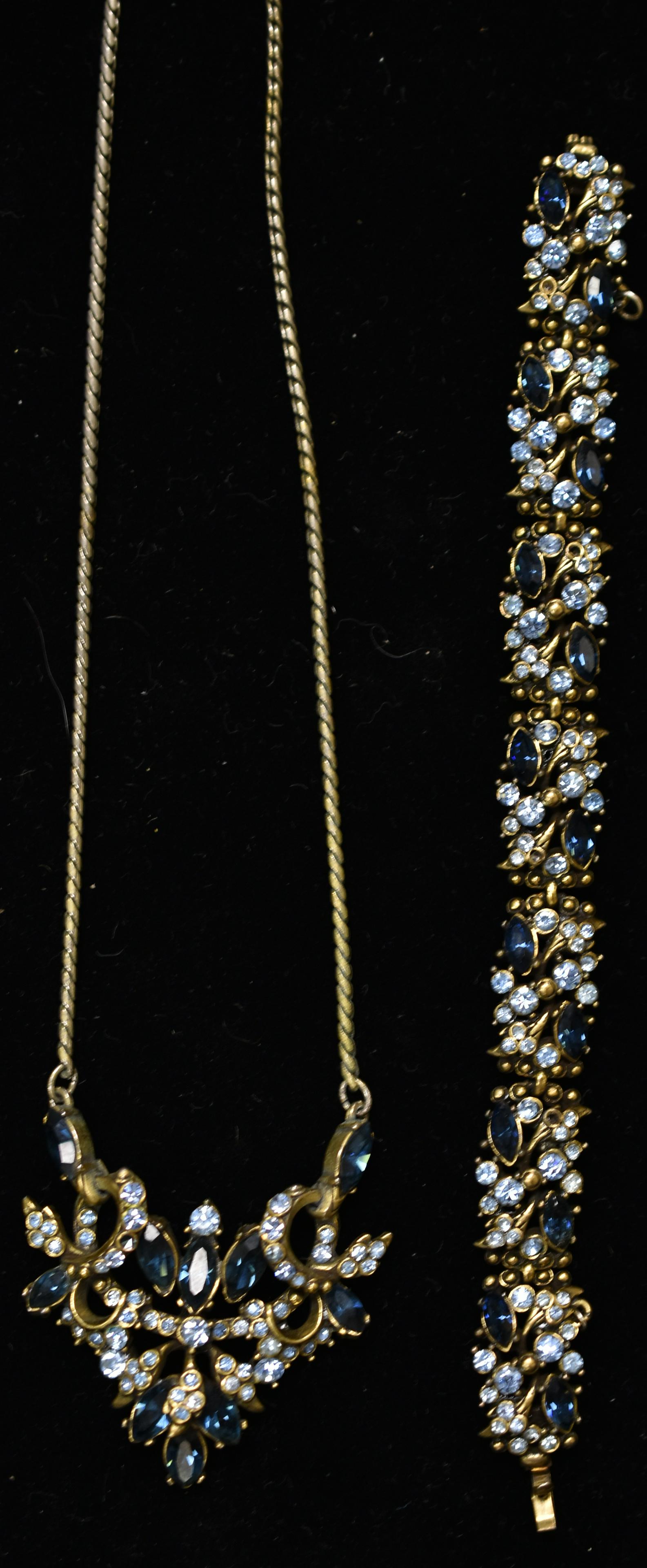 1952 Hollycraft Blue Rhinestone Set: includes necklace with pendant and matching bracelet both with brilliant and pastel blue stones, both are signed. Necklace missing a stone and bracelet missing two stones.