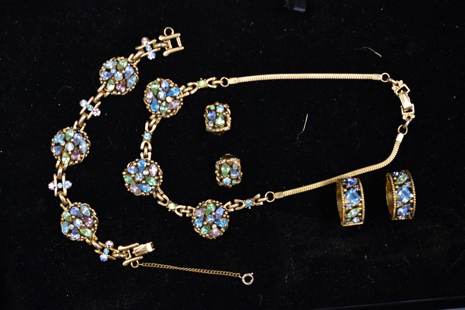 Vintage Barclay Pave Set: including a choker, bracelet, clip earrings and two hinged rings (larger than size 7), all with multi color pastel rhinestones. Marked Barclay.