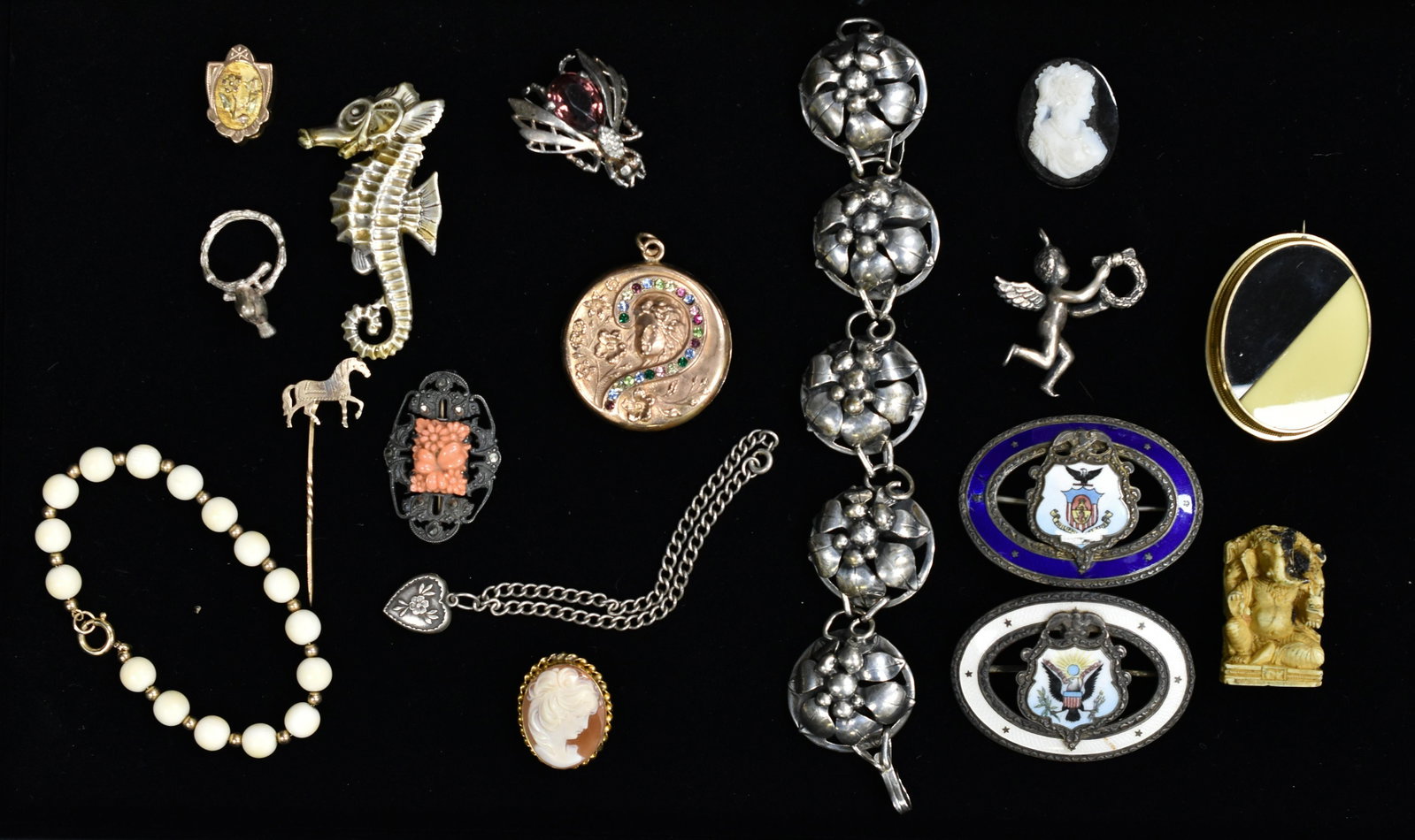 Victorian -1940s Sterling Grouping: Includes two Sterling Enamel Eagle and flag buckles (one has slight enamel loss), Victorian gold fill maiden locket with stones, cherub pendant with laurel wreath, floral bracelet, pins, heart bracele