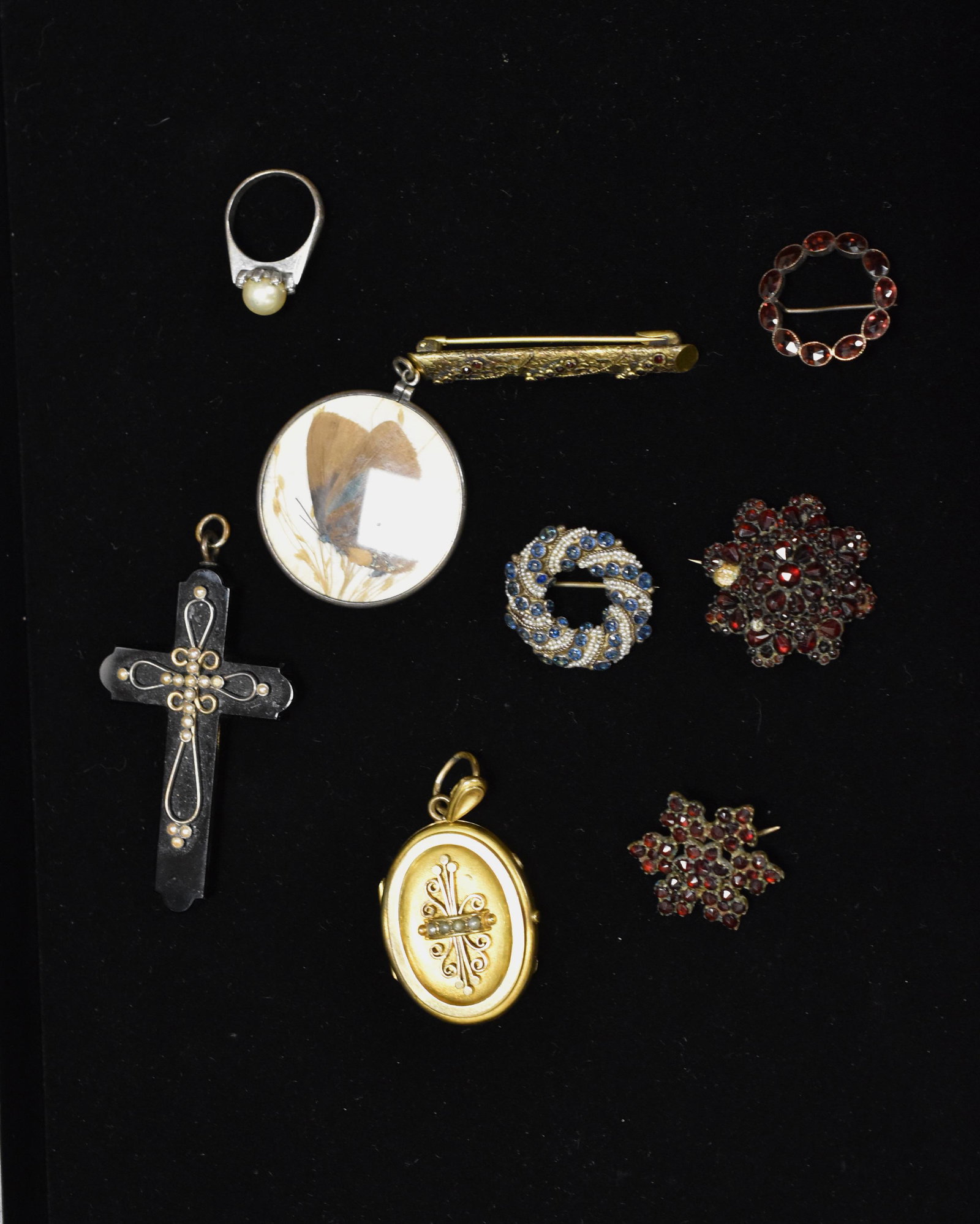 Victorian Jewelry Grouping: This includes 4 pc garnet jewelry (largest missing some stones), seed pearl locket, large jet cross with seed pearls, Austrian pearl pin with blue stones and more.