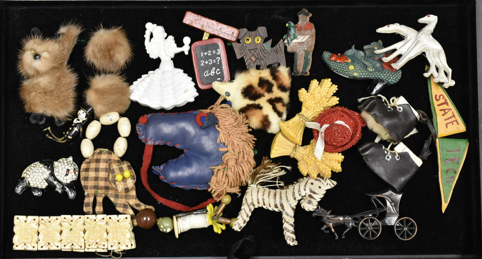 Vintage Novelty Pin Collection: includes Charlie Chaplin and Panda pot metal pins, Icart dog pin, and novelty mink and leather pins from the 1930s.