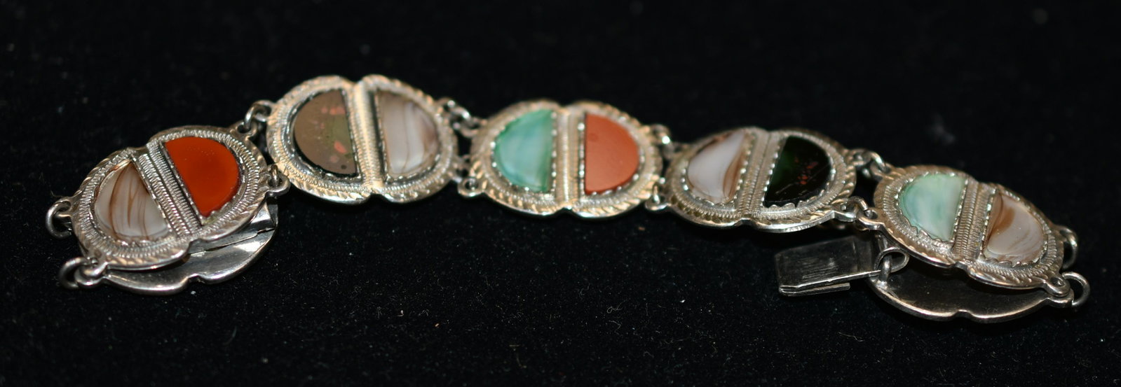 Antique Scottish Hall Marked Sterling Bracelet: The bracelet is inlaid with carnelian, onyx, bloodstone, and green agate.