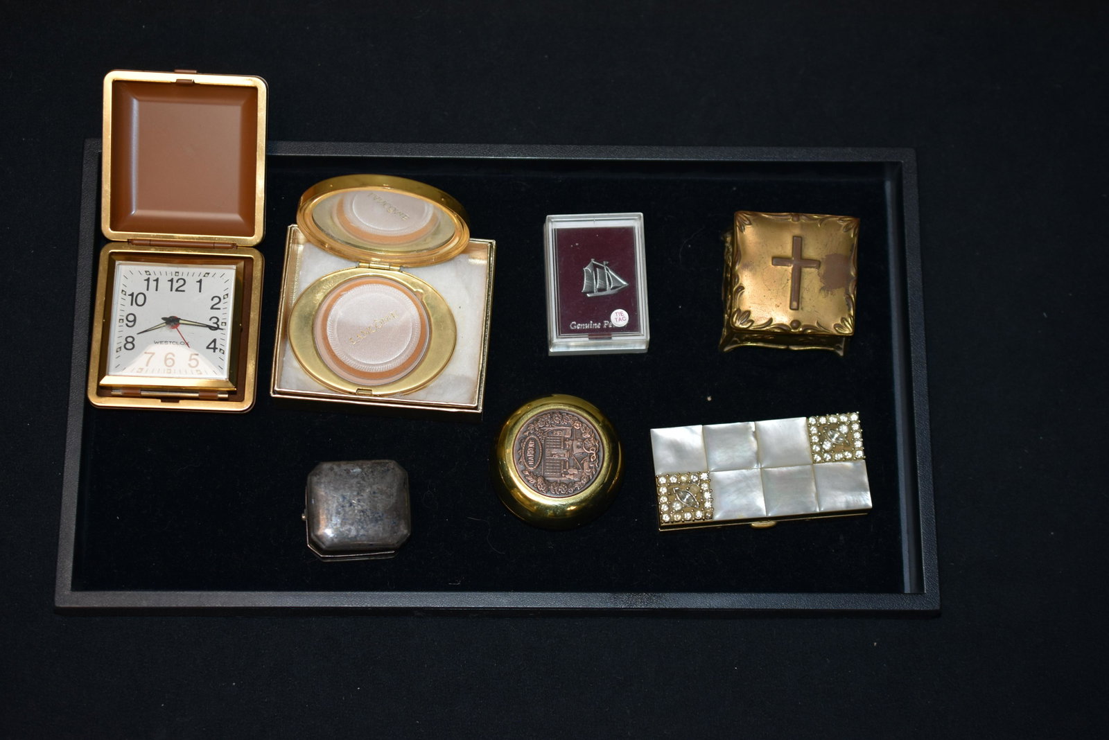 Sterling Ring Box and Others: including Birks sterling ring box, Le Classique french compact by Lancome, a trinket box with mother of pearl and rhinestone inlay (missing two stones), a Westclox alarm clock and other items.