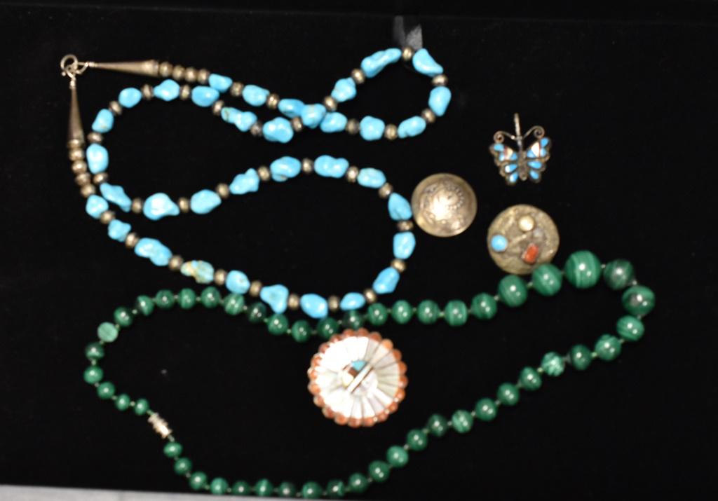Native American Sterling Turquoise and Malachite: Collection includes an early turquoise nugget and silver bead necklace, Zuni signed Verdil and Esther Nuhi pin/pendant, Zuni butterfly, two early buttons - one signed, and a malachite necklace.