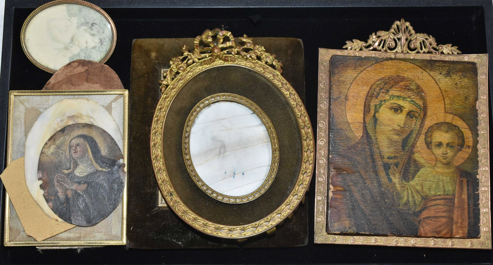 Vintage Icons and Frames: Including a lithographed icon with a copper and brass frame marked "James McCreery & Co New York" measuring approx. 7"h, a 19th century miniature painting of a nun done on tin measuring approx. 3"h an