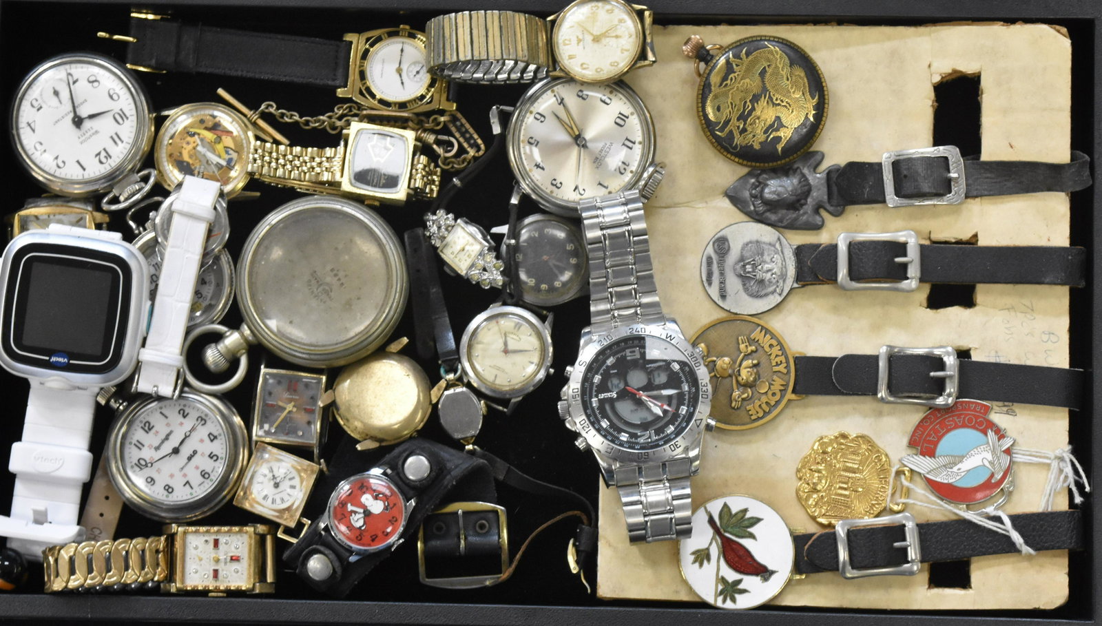 Watches and Fobs: Including a Westclox pocket Ben, a Westclox Scottie pocket watch, a Remington "Chromeglow" pocket watch, a Paris Delone pocket watch, various wrist watches and six fobs - four with leather straps.