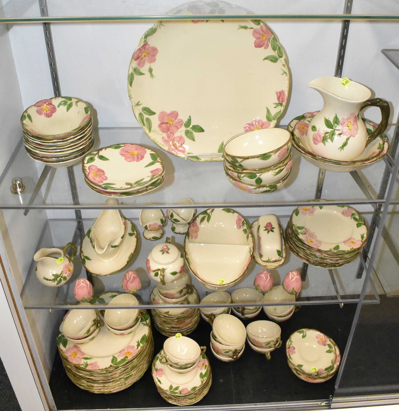 Franciscan Tea Rose China Service: Twelve 10 1/2"dia dinner plates, twelve cups and saucers, a 14"dia charger, salad plates, bread & butter plates and serving pieces.
