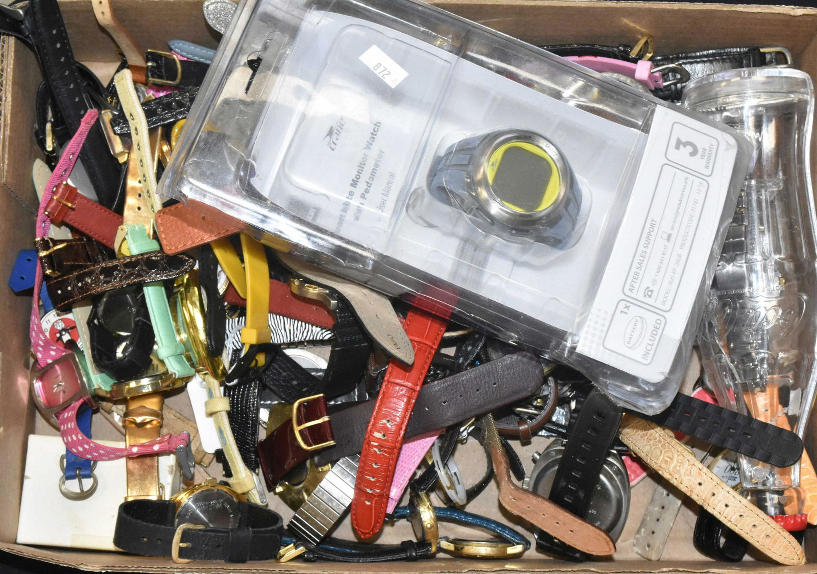 Large Grouping of Wrist Watches: Including a Coca Cola watch in a bottle, a "Hello Kitty" wrist watch, "Rice Krispie" watches, a "GH Bass" wrist watch and other collectible watches.