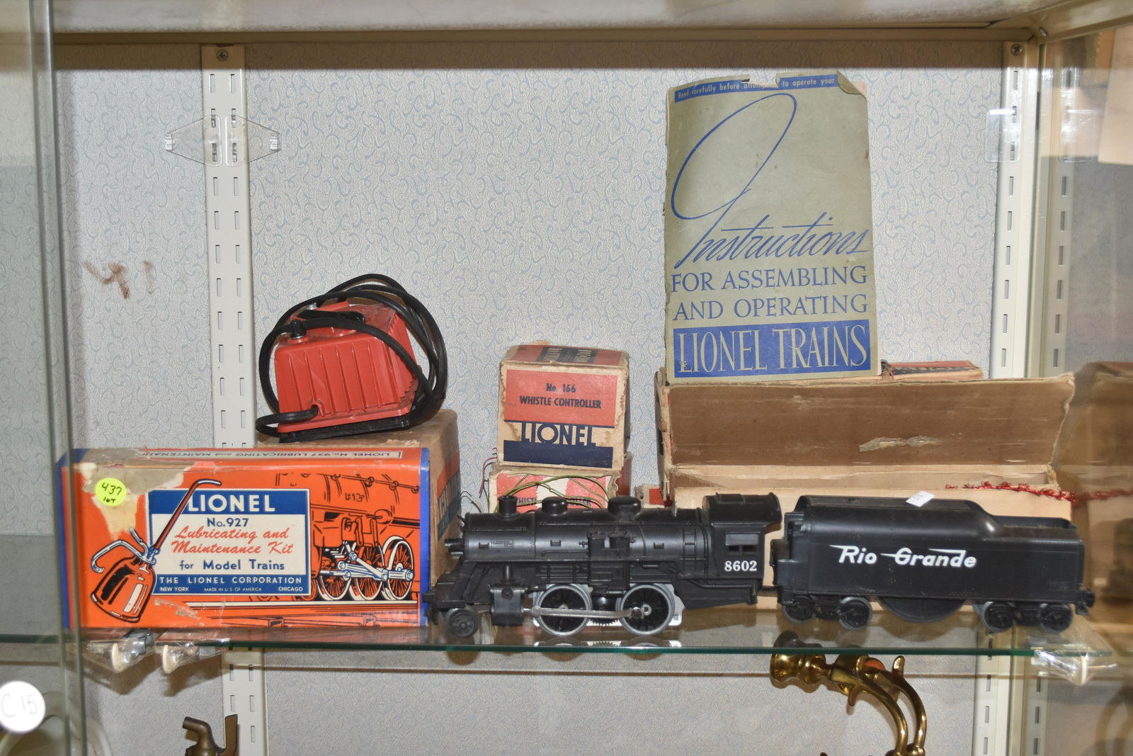 Vintage Lionel Train Group: Includes a #8602 engine, a "Rio Grande" tender, two whistle controllers both model #166, an oil car #804, a type W transformer, an RCS remote track set and a #927 maintenance kit.