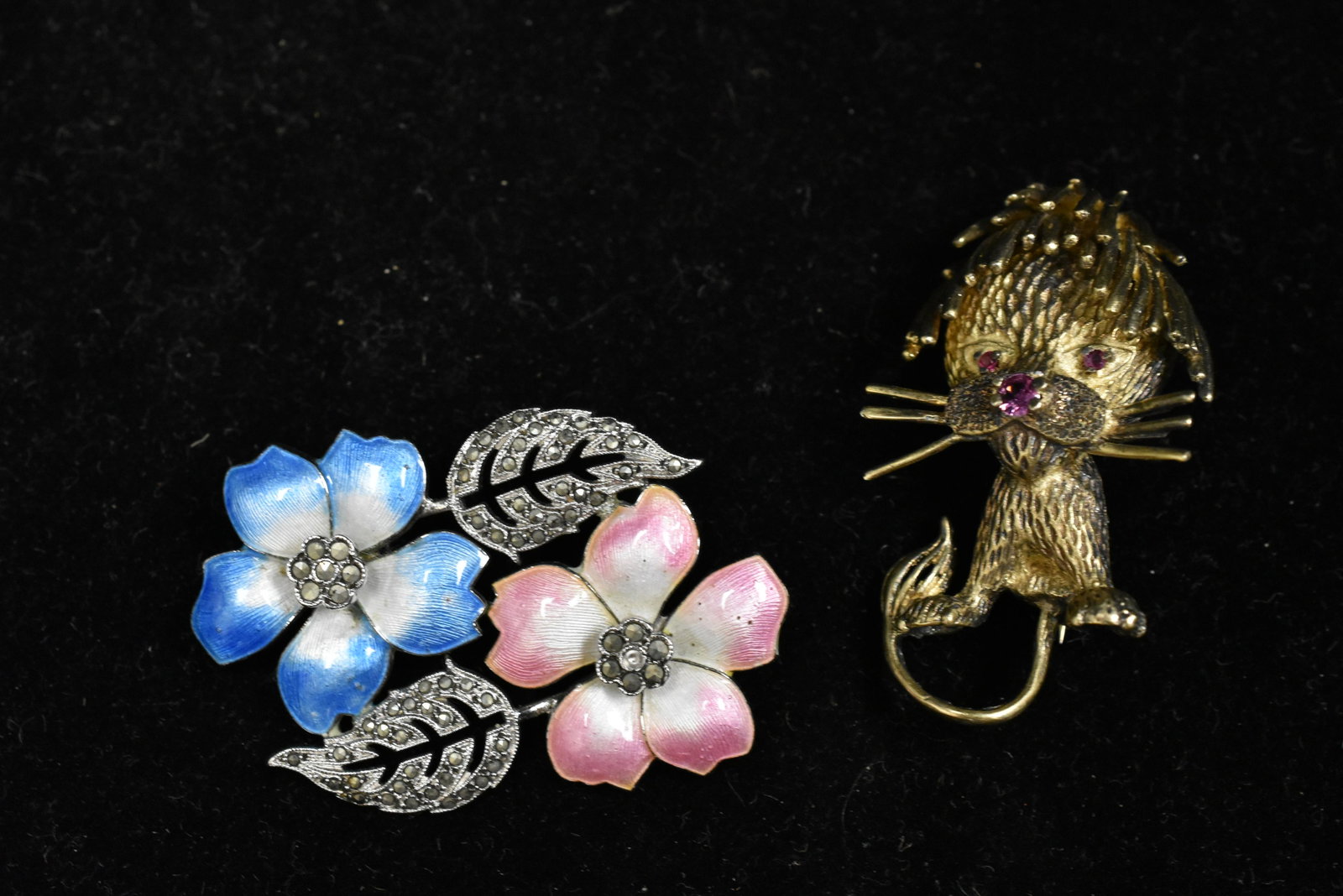 Two Vintage Sterling Pins: One pin is a lion pin signed Les Bernard and the other is a floral enamel marcasite pin.