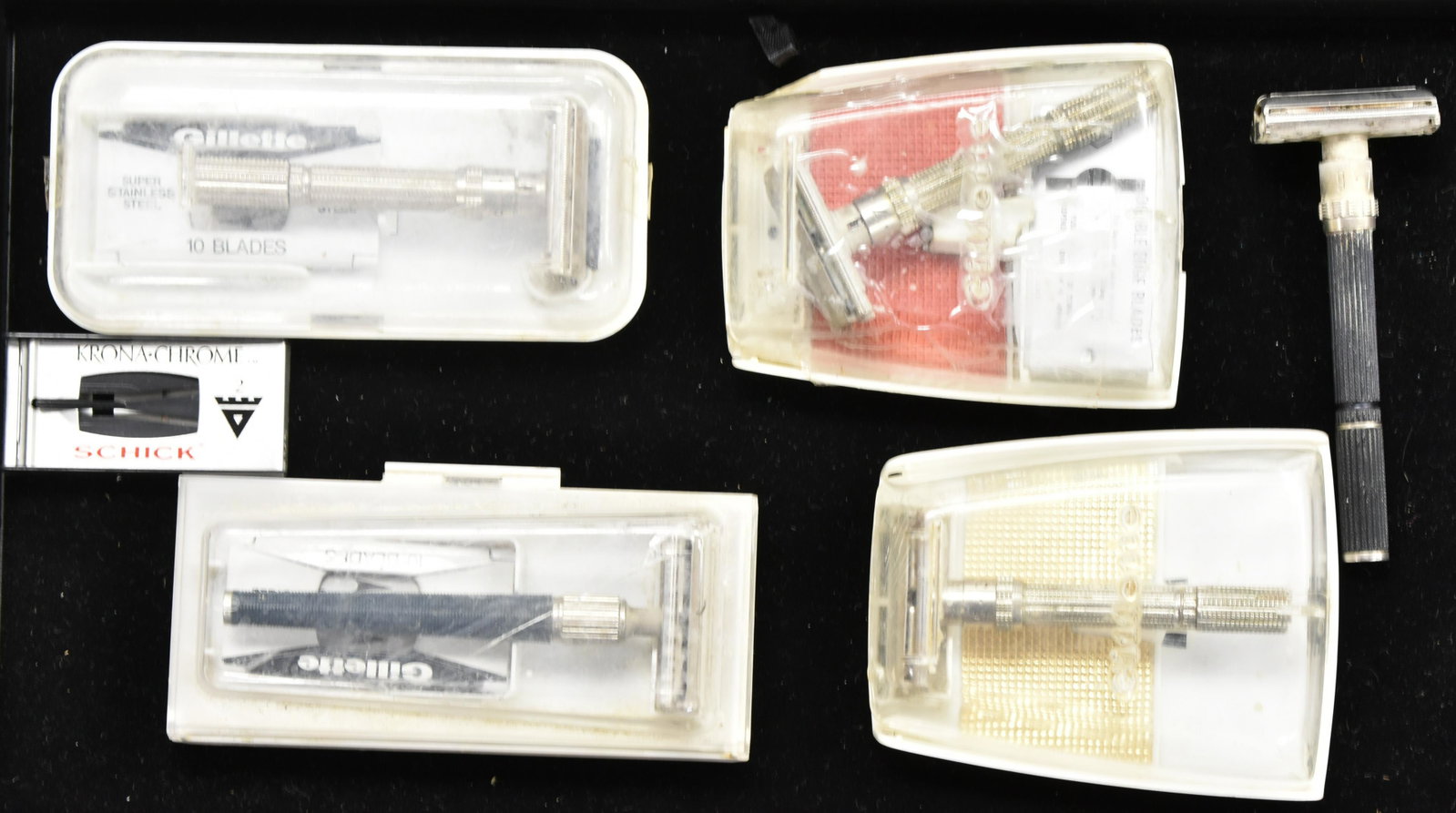 Grouping of Vintage Razors: Five vintage double edged razors - four in original packaging.