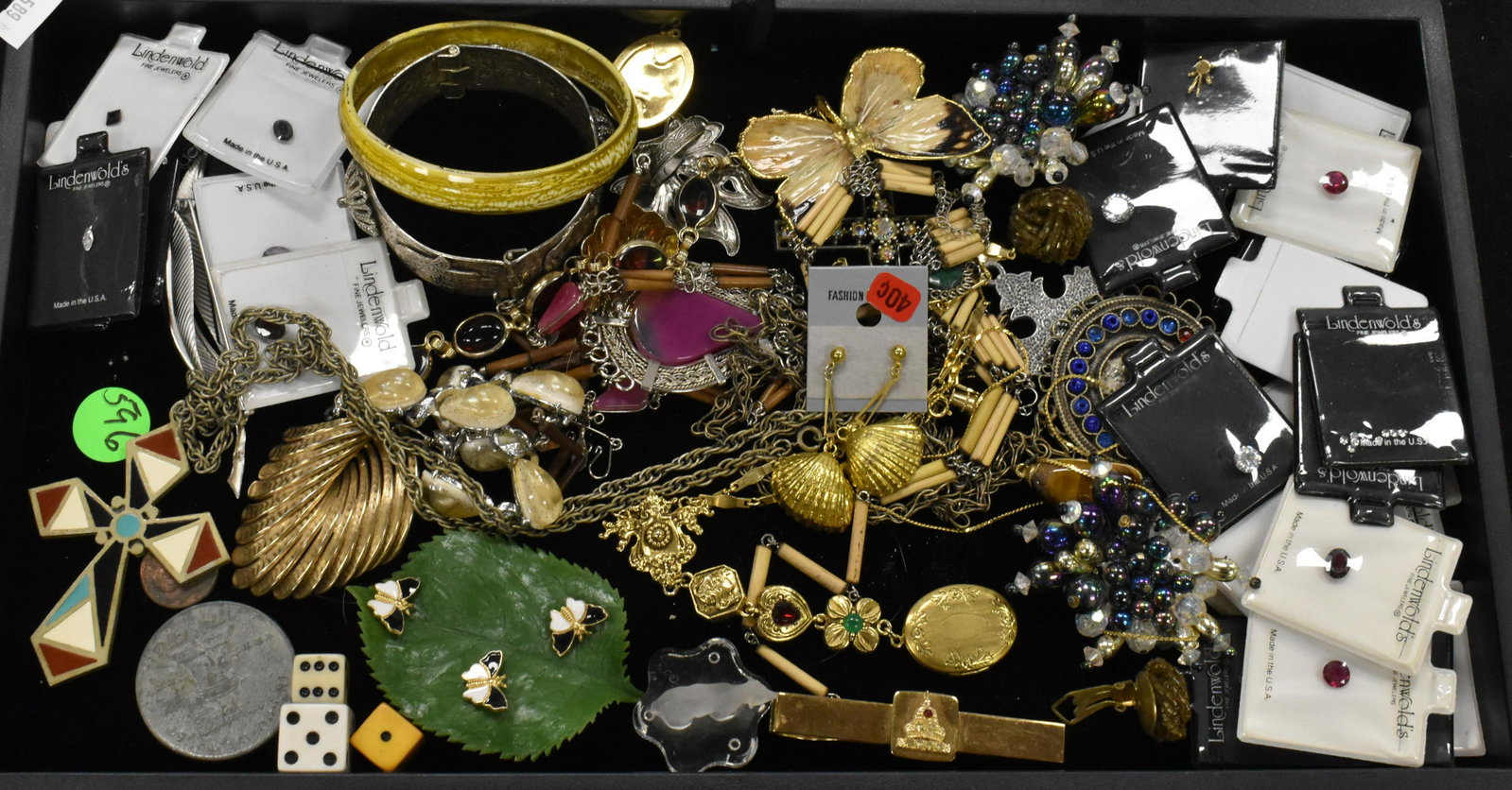 Jewelry and "Lindenwold" Stones: A large selection od "Lindenwold" stones in packs, a brass butterfly pin, a gold tone necklace with locket and other costume jewelry.