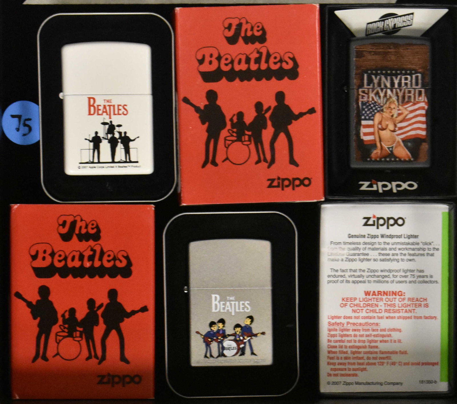 The Beatles and Another Zippo (3): Two The Beatles and one Leonard Skynard Zippo lighter; one Beatles silhouette of band, one color cartoon of the Beatles, and a Skynard with flag and girl.