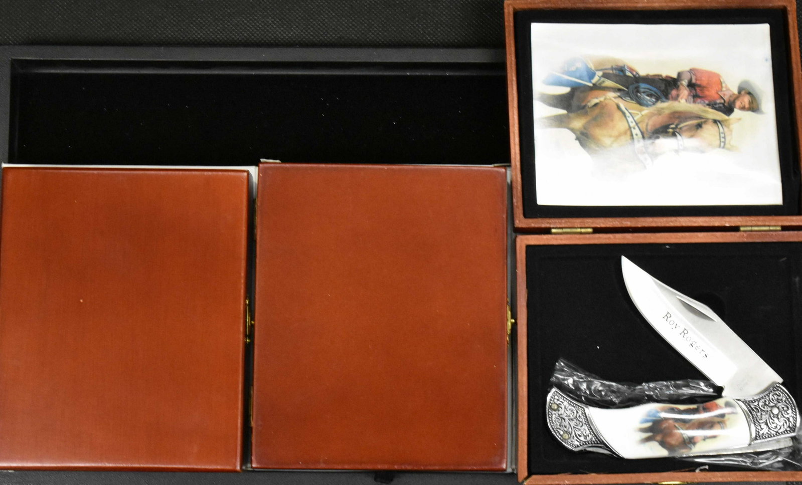 Three Western Novelty Knives: Red Ryder, Roy Rogers and Hopalong Cassidy in wood box with photo.